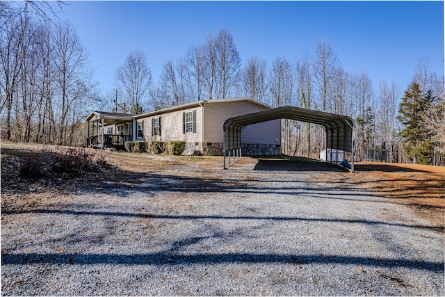 view of front of property featuring a carport and a porch