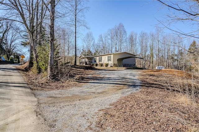 view of side of home featuring a carport