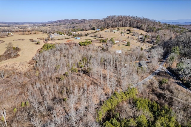 birds eye view of property with a rural view