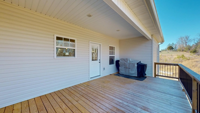 wooden terrace featuring area for grilling