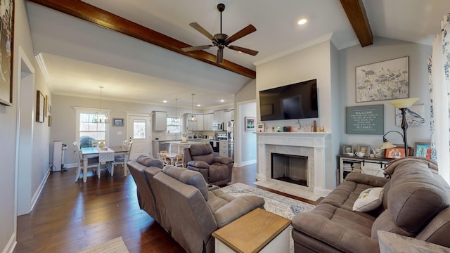 living room featuring ornamental molding, lofted ceiling with beams, ceiling fan, and dark hardwood / wood-style flooring