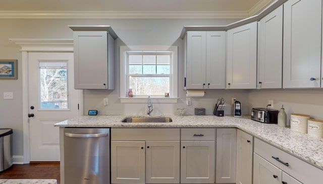 kitchen with light stone countertops, sink, a wealth of natural light, and stainless steel dishwasher