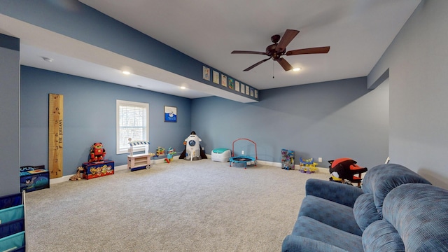 rec room featuring ceiling fan and carpet flooring