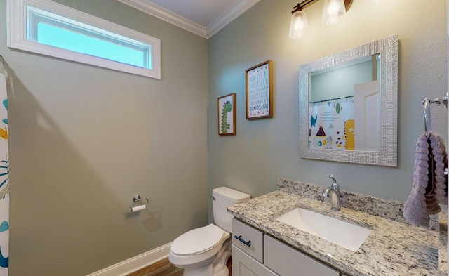 bathroom with vanity, toilet, ornamental molding, and wood-type flooring