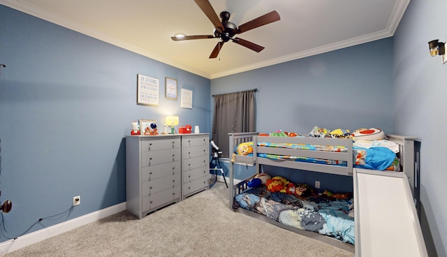 carpeted bedroom with crown molding and ceiling fan