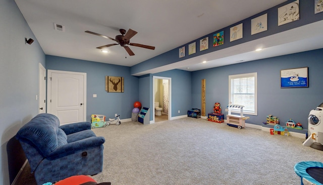 game room with ceiling fan and carpet