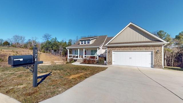 craftsman-style house with a garage, covered porch, and a front lawn