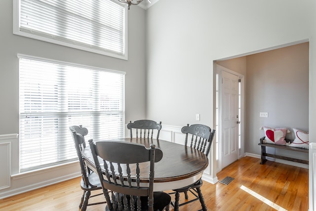 dining space with light hardwood / wood-style flooring