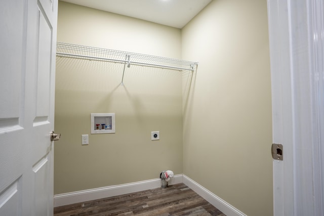 clothes washing area featuring electric dryer hookup, washer hookup, dark wood-style floors, baseboards, and laundry area