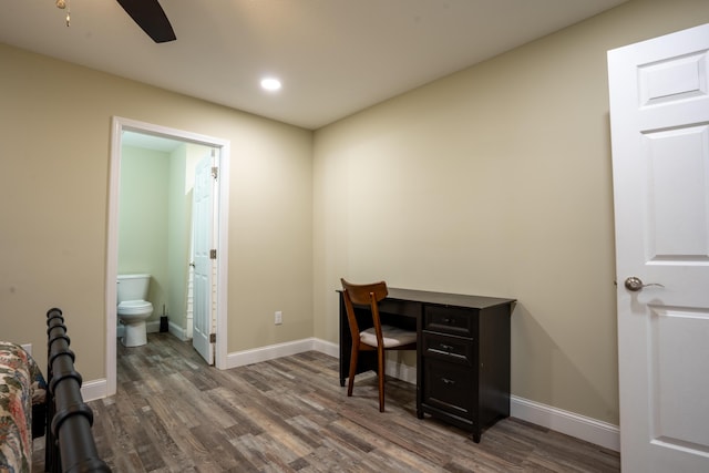 office featuring dark hardwood / wood-style floors and ceiling fan