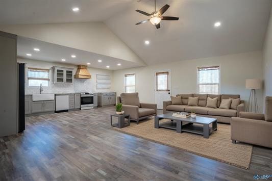 living room with recessed lighting, high vaulted ceiling, ceiling fan, and wood finished floors