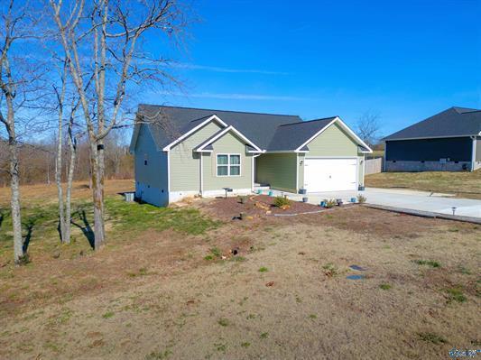 ranch-style house with a front lawn