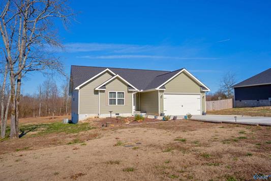 ranch-style home featuring crawl space, an attached garage, and fence