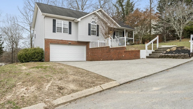 view of front of property featuring a porch and a garage