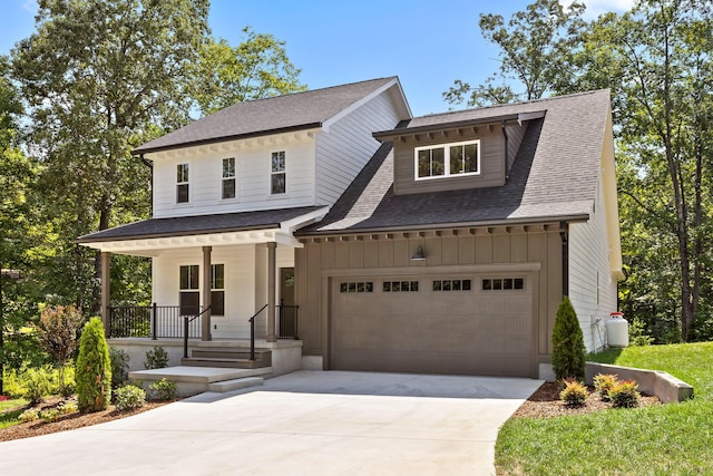 view of front facade with a porch and a garage