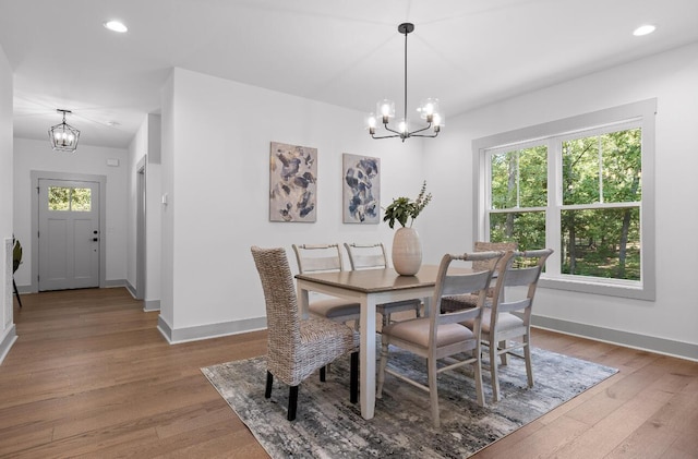 dining room featuring an inviting chandelier and wood-type flooring