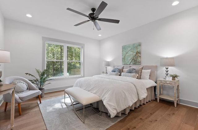 bedroom featuring light wood-type flooring and ceiling fan