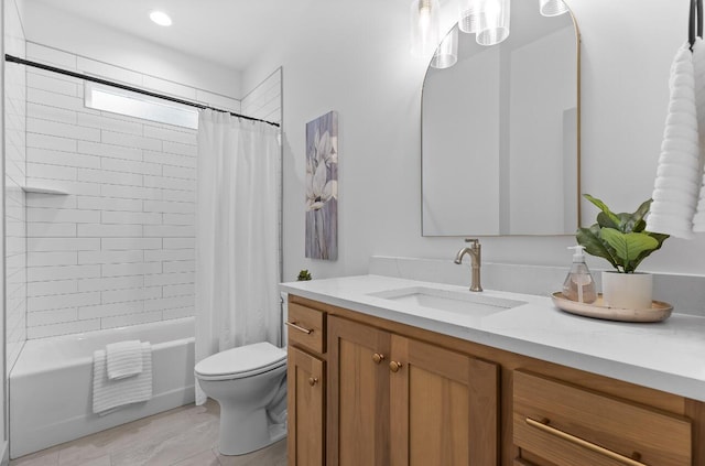 full bathroom featuring shower / bath combo with shower curtain, toilet, and vanity