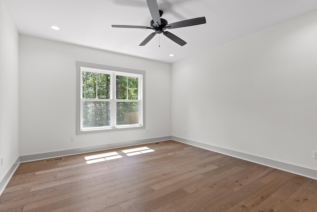 spare room featuring ceiling fan and light wood-type flooring