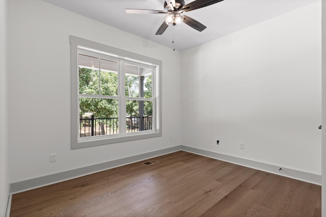 spare room featuring ceiling fan and hardwood / wood-style flooring