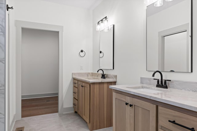 bathroom featuring tile patterned flooring and vanity