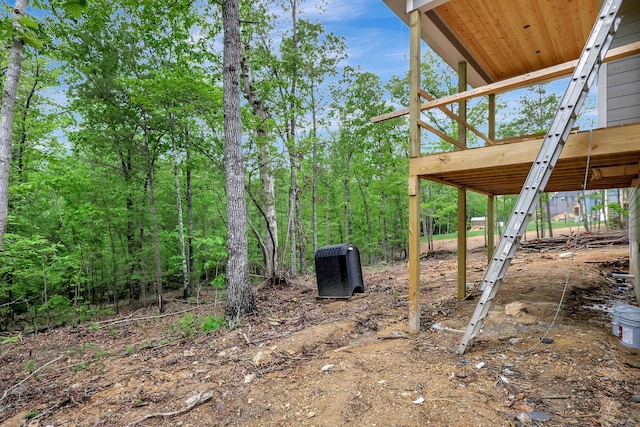 view of yard with a wooden deck