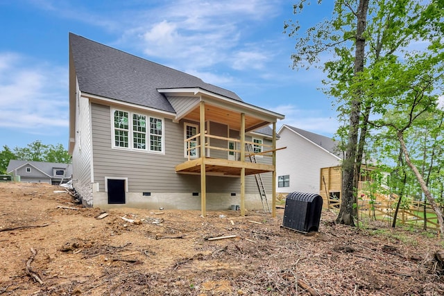 back of property featuring central air condition unit, a shingled roof, and crawl space