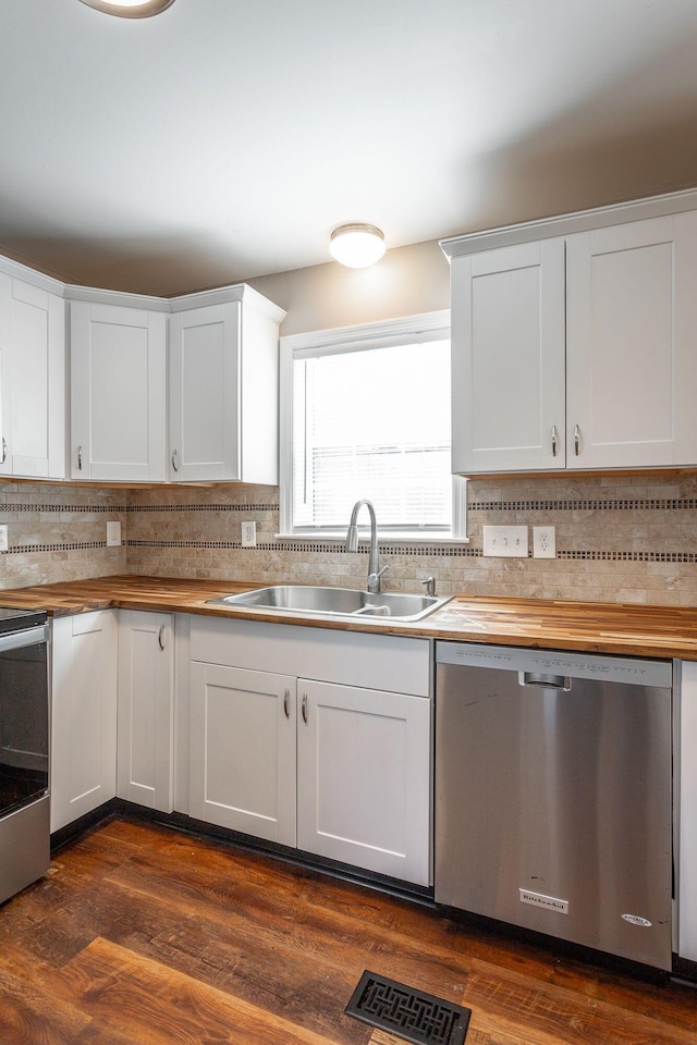 kitchen with sink, white cabinetry, and appliances with stainless steel finishes