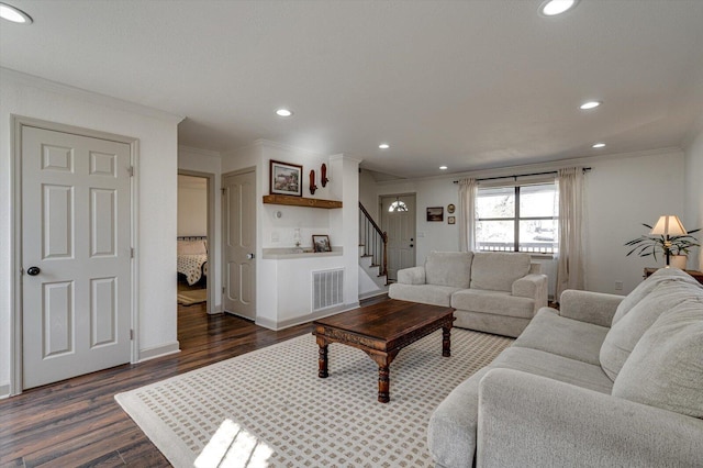 living room with crown molding and dark wood-type flooring