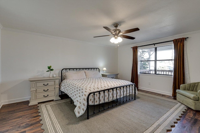 bedroom with crown molding, ceiling fan, and dark hardwood / wood-style flooring