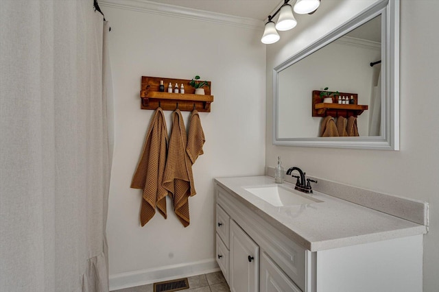 bathroom featuring tile patterned floors, vanity, and crown molding