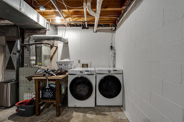 clothes washing area with independent washer and dryer