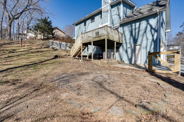 rear view of property with a deck