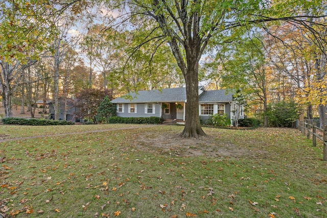 single story home featuring a front yard