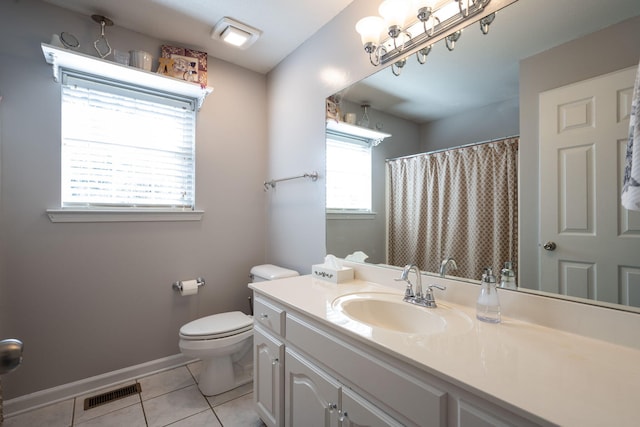 bathroom featuring tile patterned floors, vanity, and toilet