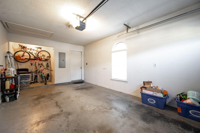 garage featuring electric panel and a garage door opener