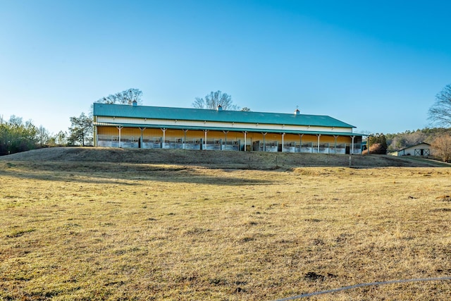 view of outbuilding with a yard