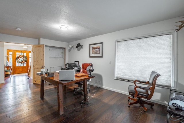 office space featuring dark hardwood / wood-style floors and a textured ceiling