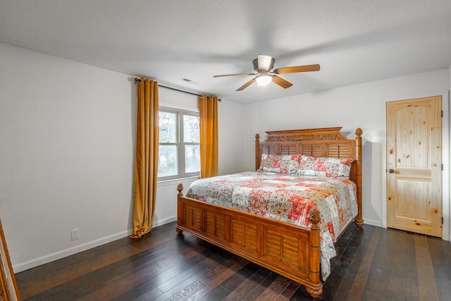 bedroom with dark hardwood / wood-style floors and ceiling fan