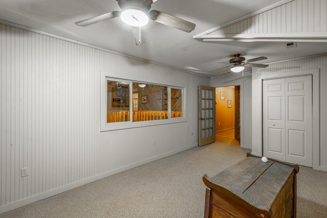 unfurnished bedroom with ceiling fan and a closet