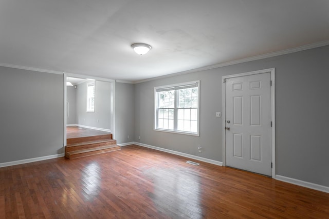 entryway featuring dark hardwood / wood-style floors and ornamental molding