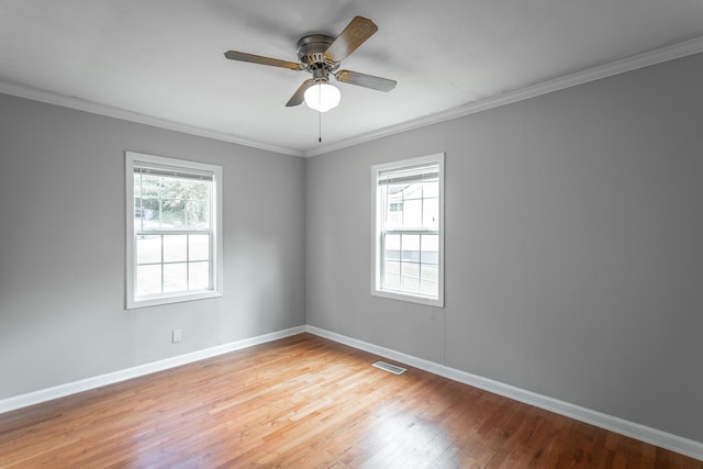 unfurnished room with light hardwood / wood-style floors, ceiling fan, and ornamental molding