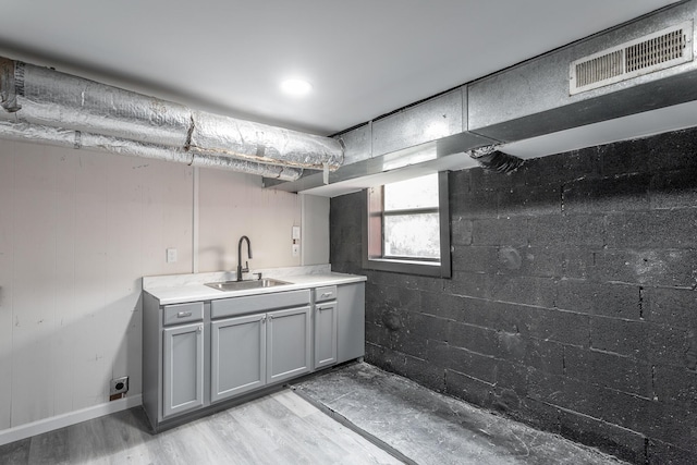 bathroom with hardwood / wood-style floors and vanity