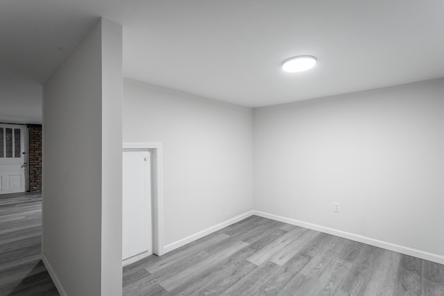 unfurnished room with light hardwood / wood-style floors