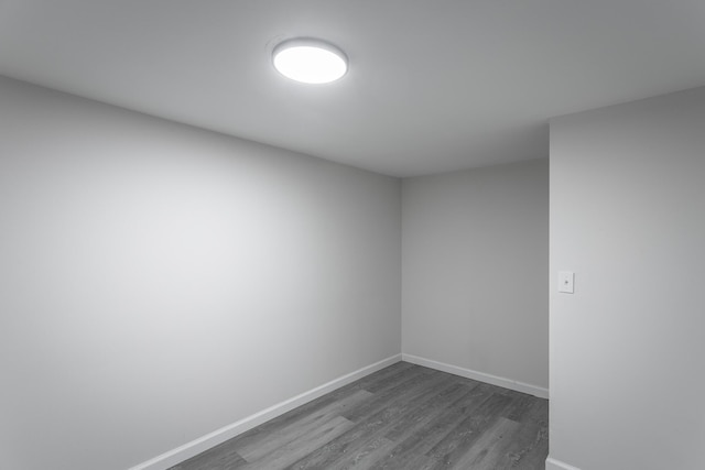 empty room with dark hardwood / wood-style floors