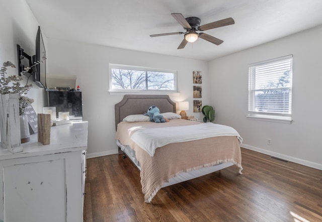 bedroom featuring ceiling fan and dark hardwood / wood-style flooring