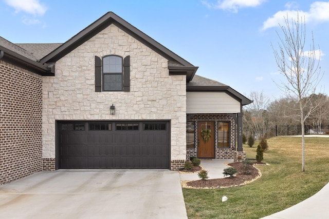 view of front facade with a garage and a front lawn