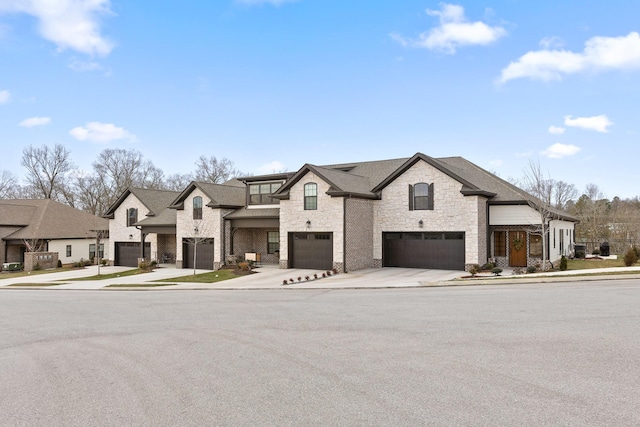 french country home featuring a garage