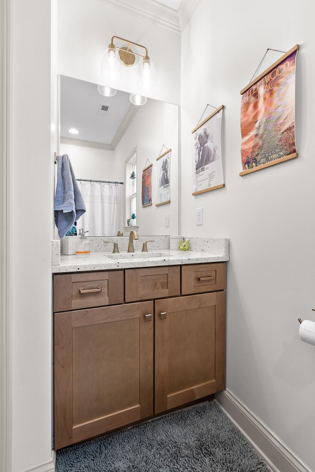 bathroom with a shower with curtain, ornamental molding, and vanity