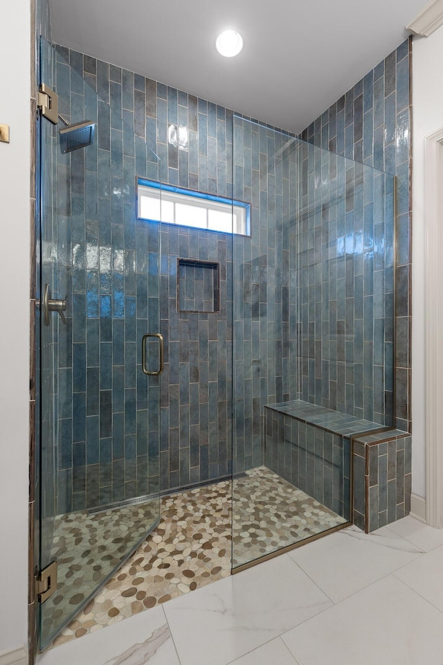 bathroom with tile patterned flooring and a shower with shower door